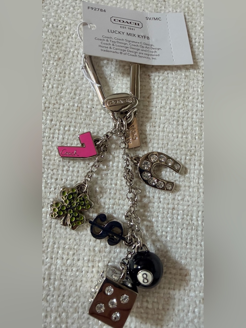 NWT Coach Pave Good Luck Mix key chain featuring dice, clover, horseshoe, 8 Ball